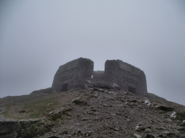 At the summit of Moel Famau in cold, dank conditions