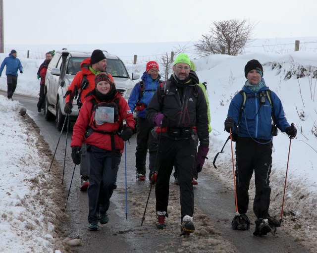 Annabell, Ian, Brian, Thomas and Jin walking to the finish, heads held high (Spine)