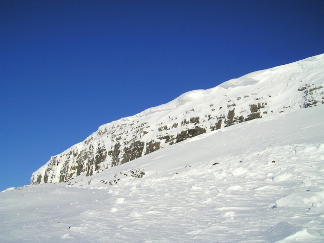Cornices on Pen y Ghent crag in the Yorkshire Dales, with some evidence of avalanche debris