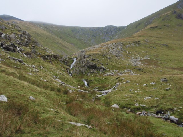 Waterfall in the upper reaches of the narrowed valley ….