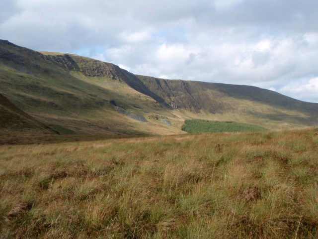 The Flying Fortress crashed into the hillside to the right of the trees below the crag 