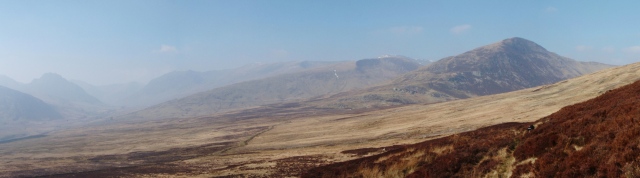 The southern mountains of the Carneddau with Tryfan just creeping in through the haze  (far left)